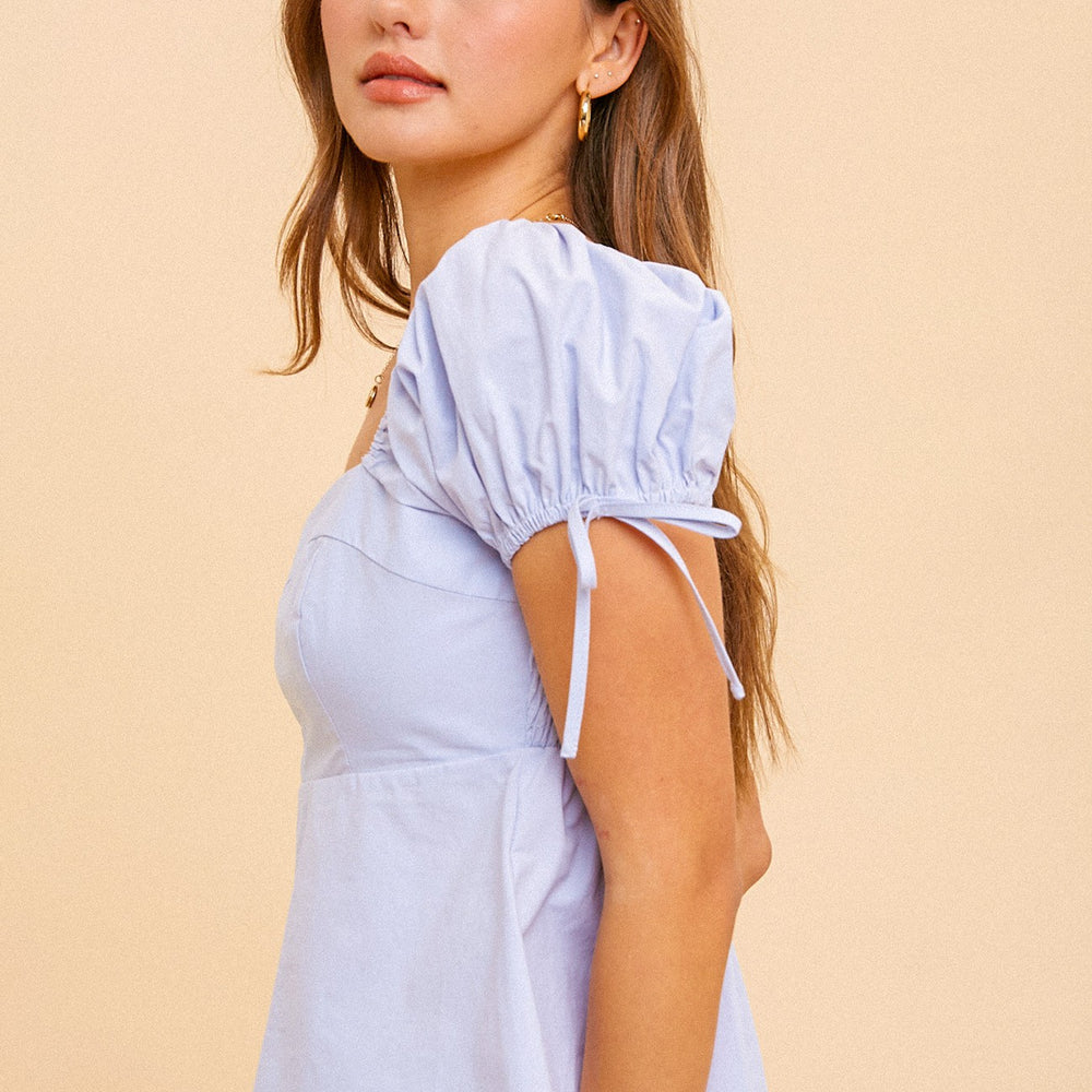 
                      
                        Poplin babydoll top
                      
                    