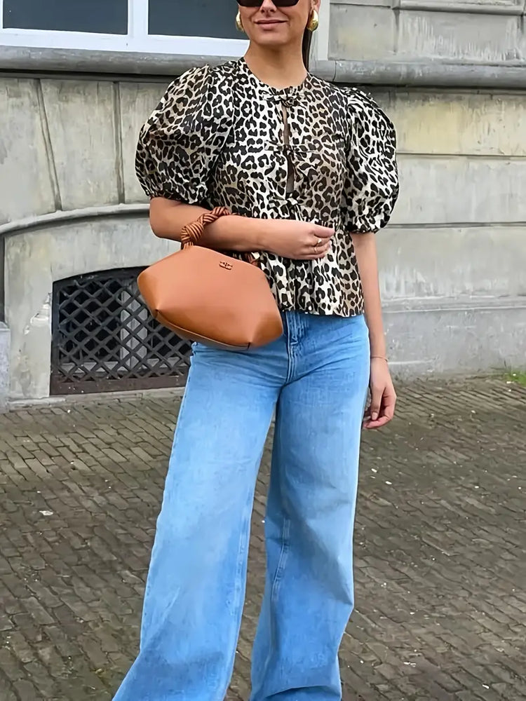 
                      
                        Chic Leopard Print Blouse with Tie-Front Detail
                      
                    