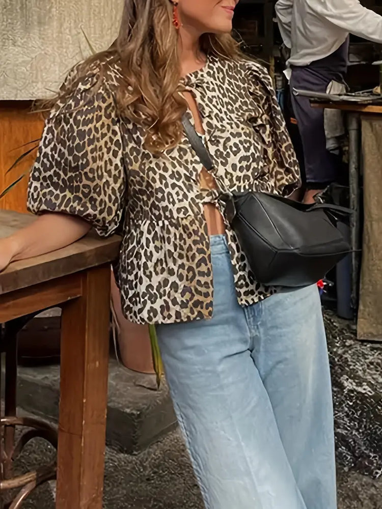 
                      
                        Chic Leopard Print Blouse with Tie-Front Detail
                      
                    